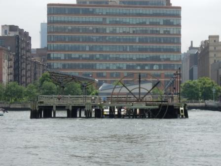 Paddle wheel scultpture on dock